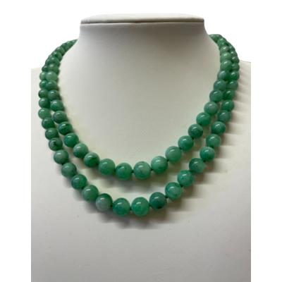 Double row jade bead necklace. Antique necklace with 2 rows of graduating jade beads, each individually knotted. Gold clasp. Shorter row measures 380mm and longer one is approximately 400mm. Main photo of necklace displayed on a stand and seen front facing.