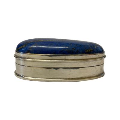 Sterling silver and lapis lazuli box. A good size small sterling silver box with a large lapis lazuli cabochon to the lid. The stone makes the lid top heavy which gives weight to a tight closing box. The lapis stone is of very good quality. Hallmarked 925 for sterling silver to the base. Main photo of the box seen from eye level clearly showing the thickness of the lapis stone on the lid.