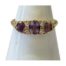 Victorian 18 karat gold trilogy ring. Pretty antique trilogy ring set with 3 oval cut amethysts which are separated with 2 round cut diamonds. The shoulders are plain in contrast to the very fancy gallery. Ring size S / 9. Main photo of ring displayed on a cone shaped stand and seen with the front facing forward.