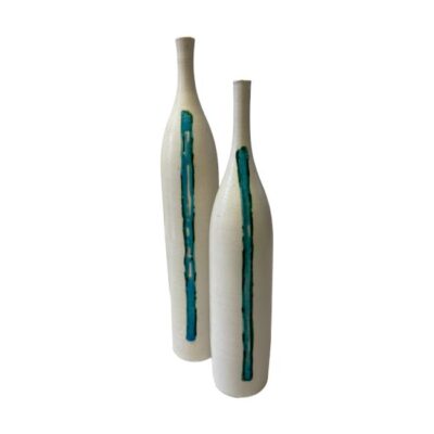 Pair of pottery vases by Kate Bramwell Cole. Aesthetically eye catching pair of tall slender studio pottery vases in a creamy white with a single horizontal turquoise stripe. Unmistakable stamp of Kate Bramwell Cole at bottom of each. Not very practical as vases - would look great with a peacock feather in each or just as they are! The taller vase measures 300mm tall and 50mm in diameter at base. The smaller vase is 270mm tall and 50mm at base. Main photo of both vases seen with turquoise stripe in the foreground. The smaller vase is slightly in front of the taller one and set off to the right.