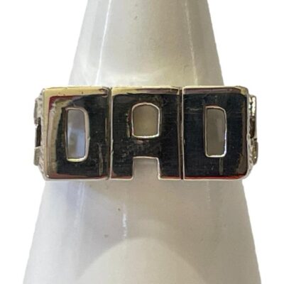 Sterling silver DAD ring. Modern ring in sterling silver with DAD spelt out to the front. Interesting chain like work to the shoulders. Hallmarked 925 for sterling silver. Ring size W.5 / 11.25 Ring weight 7.2gms. Main photo of ring displayed on a cone shaped stand and seen forward facing.